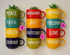 Colorful mugs with motivational words and small plants on a light background