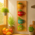 Decorative wall panel with colorful mugs holding plants in a kitchen setting.