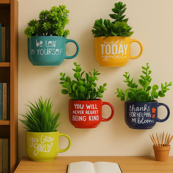 Decorative wall-mounted mugs with plants and motivational quotes on a beige wall.